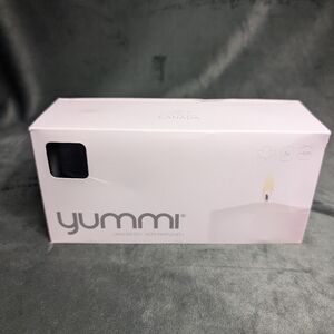 NWT Yummi 3x4 Black Pillar Candles 3 pack 40 hours. Clean Burning. MSRP $28